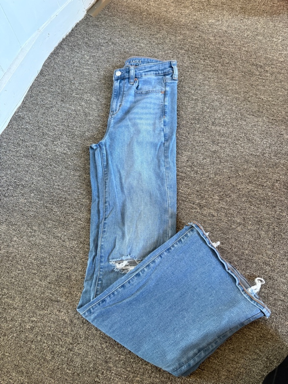 American Eagle Outfitters Light Blue Flare Jeans with Distressed Hem